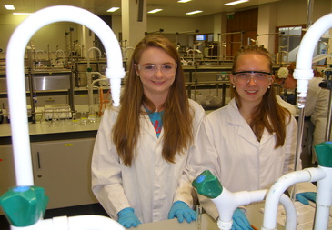 two students in white coats