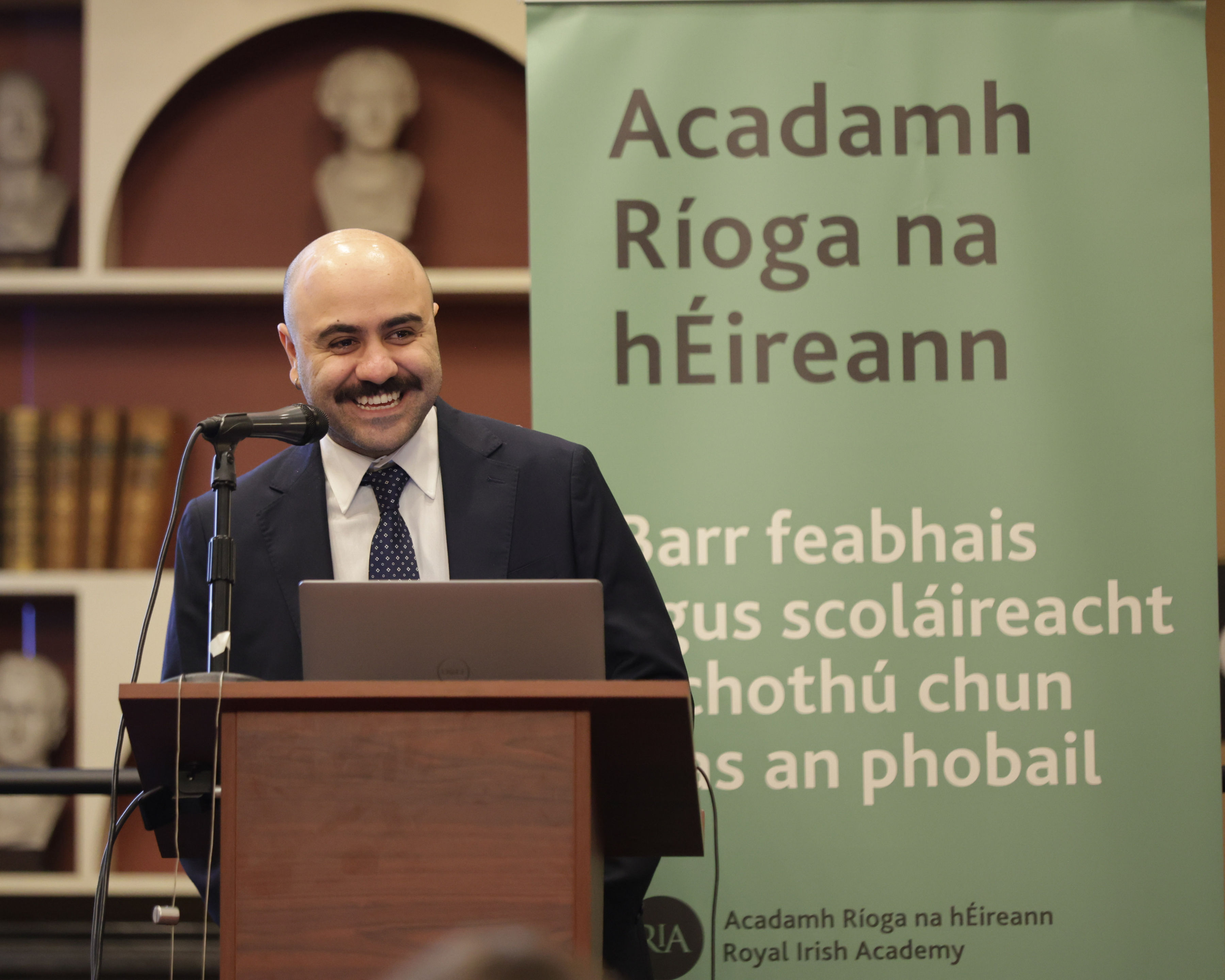 Dr Pota presents his research during the ceremont at the Royal Irish Academy