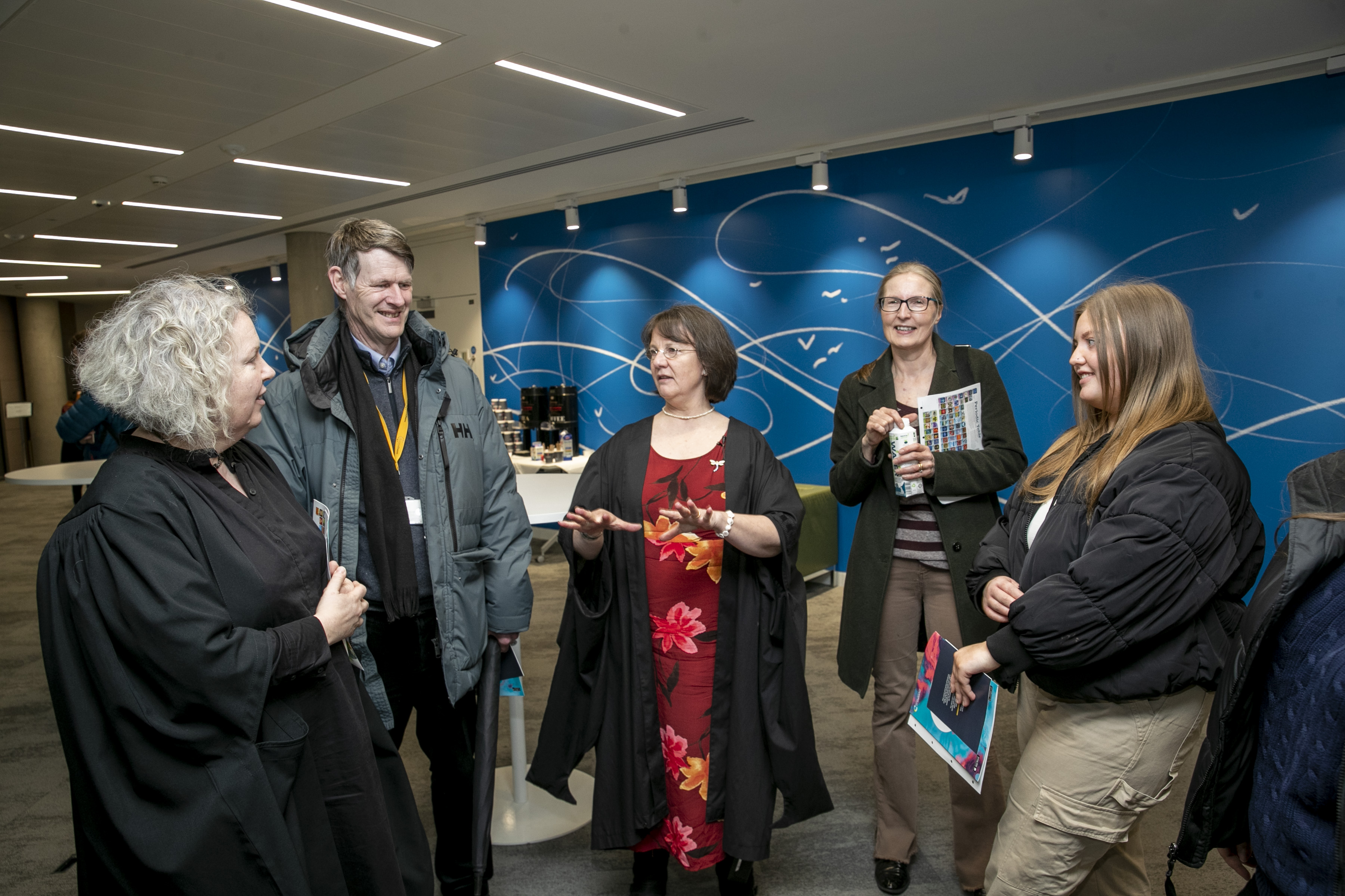 Prof. Draper (centre) with the provost and other attendees